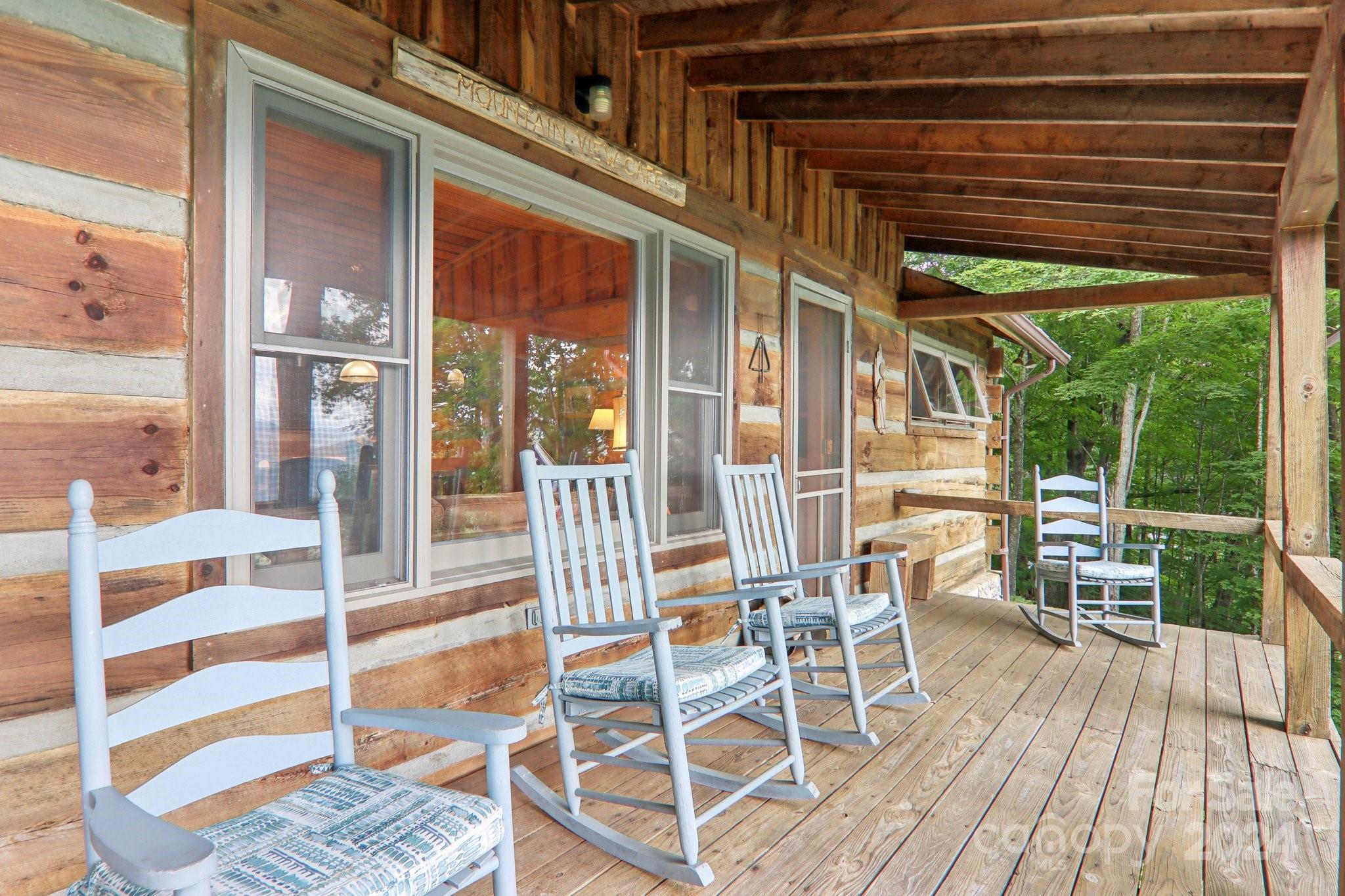 1685 Setzercove Road Maggie Valley, NC 28751 - Photo 7 of 42 a view of a patio with a table and chairs