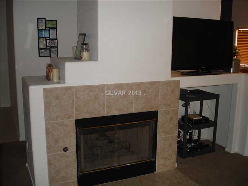 803 Rio Poco Court Henderson, NV 89015 - Photo 6 of 9 Living Room. Fireplace & Entertainment Nook