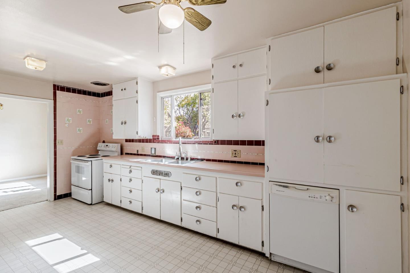 167 North Whisman Road Mountain View, CA 94043 - Photo 11 of 49 a large white kitchen with granite countertop a white cabinets and a sink