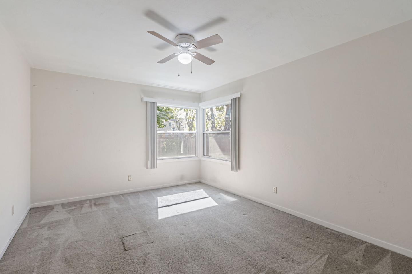 167 North Whisman Road Mountain View, CA 94043 - Photo 18 of 49 an empty room with windows and fan