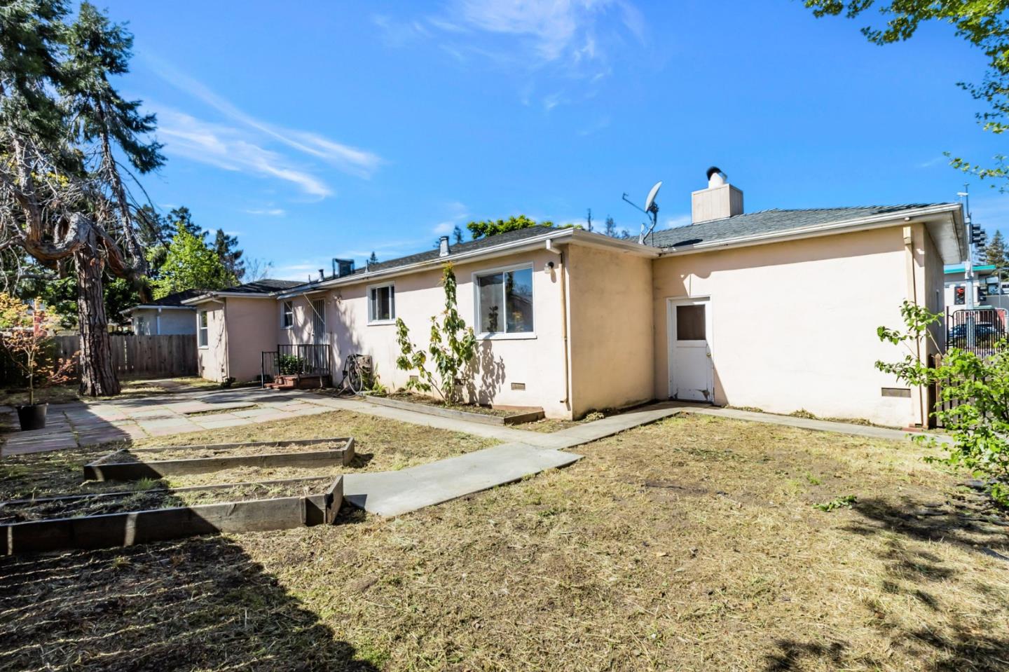 167 North Whisman Road Mountain View, CA 94043 - Photo 24 of 49 a front view of a house with a yard and garage