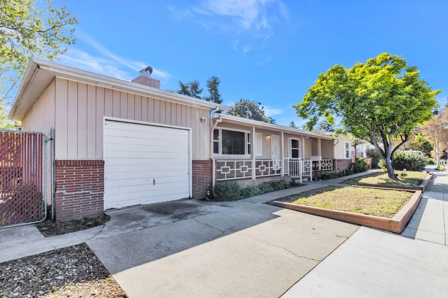 167 North Whisman Road Mountain View, CA 94043 - Photo 3 of 49 a view of a house with backyard and a tree
