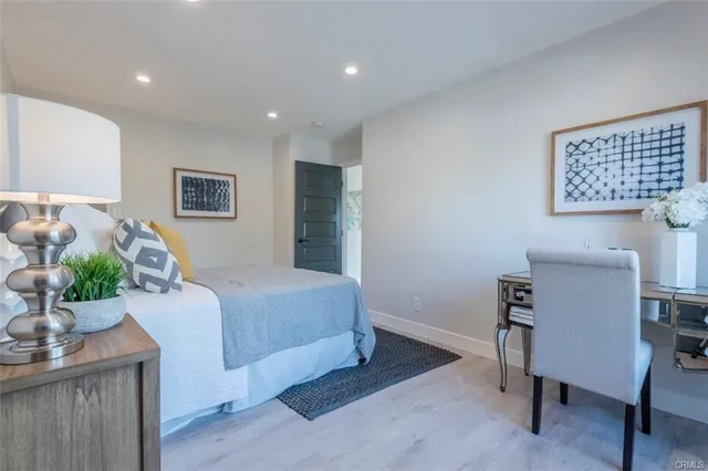 a bedroom with a bed and furniture