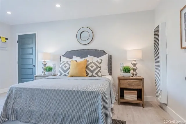 a bedroom with a bed and a table