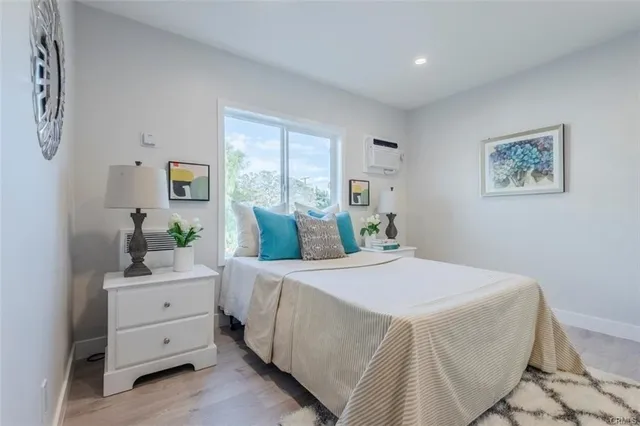 a bedroom with a bed and a dresser