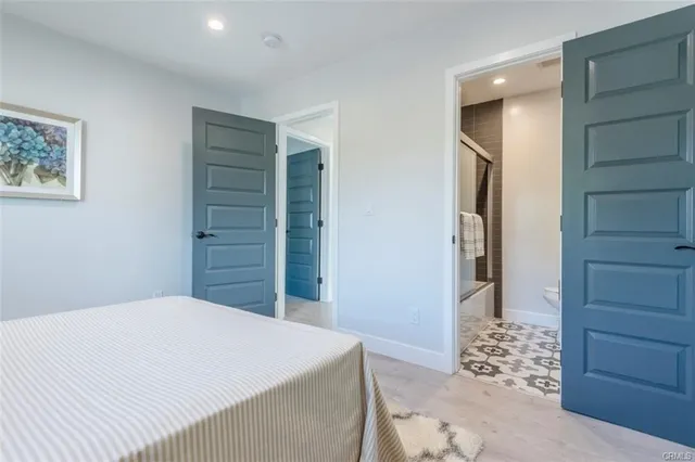 a bedroom with a bed and a cabinets