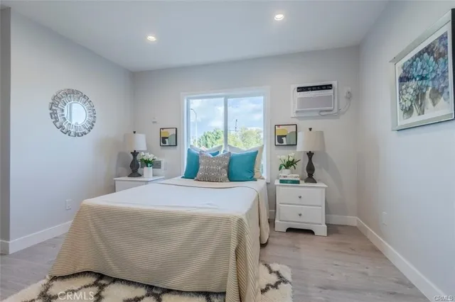 a bedroom with bed and window