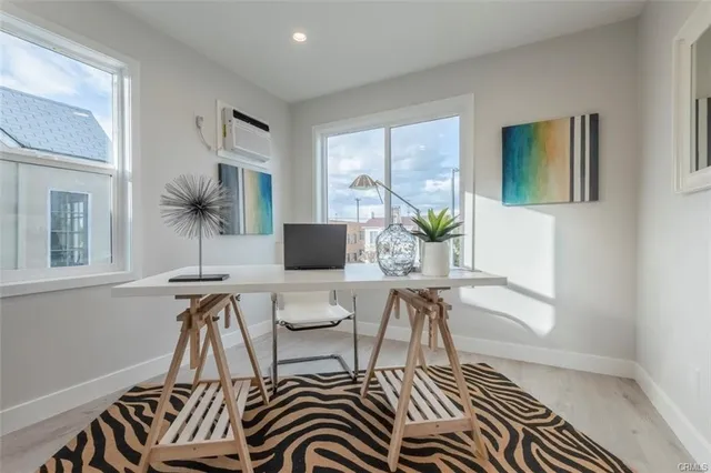 a workspace with furniture and window