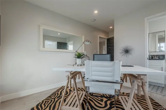 a view of a livingroom with furniture and a potted plant