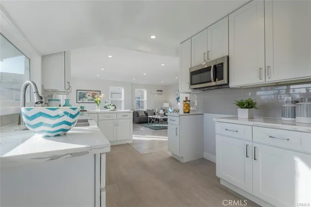 a living room with furniture wooden floor and a table