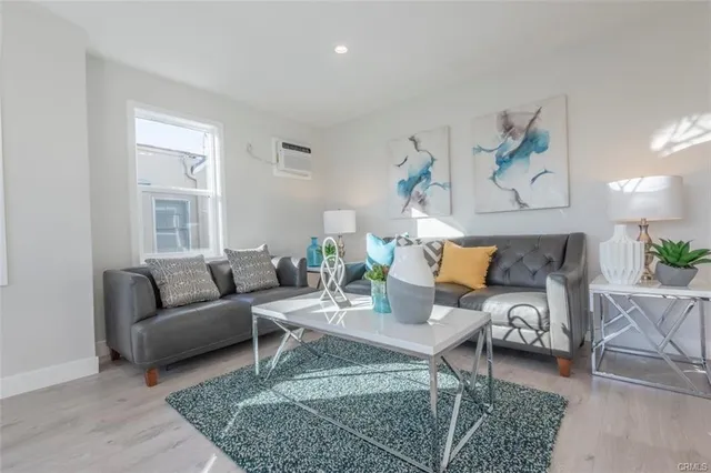 a living room with furniture and a table