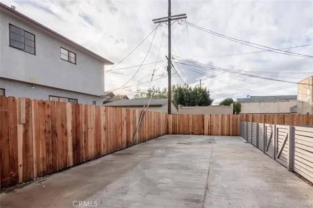 a view of a terrace with wooden fence