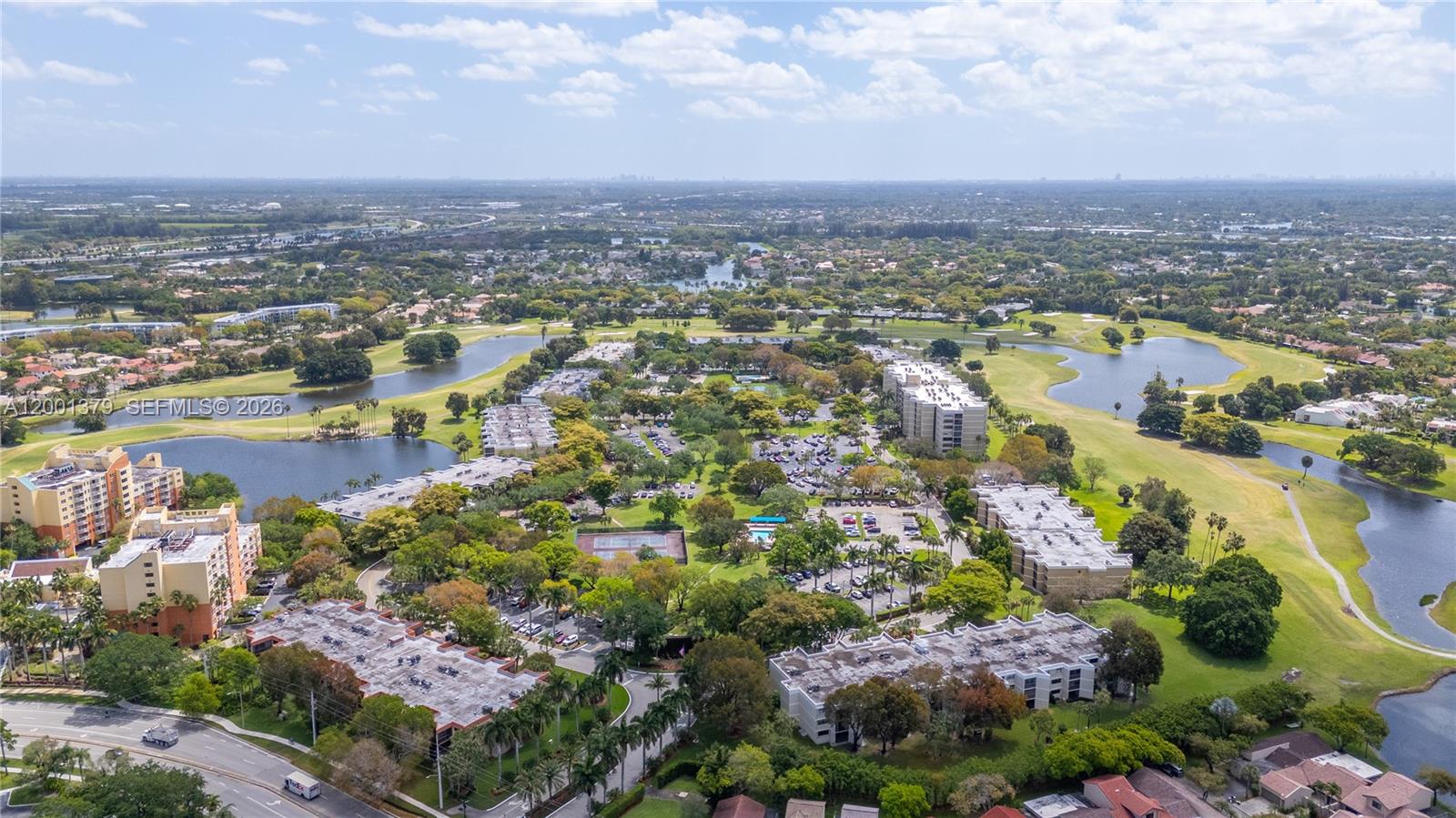 16251 Golf Club Road, Unit 311 Weston, FL 33326 - Photo 36 of 38 an aerial view of city and lake