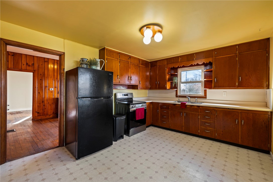 10797 Gratis Jacksonburg Road Somerville, OH 45064 - Photo 10 of 27 This spacious kitchen offers ample cabinetry and an inviting atmosphere for culinary endeavors.