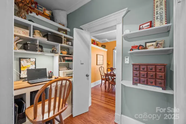 a living room with furniture fireplace and book shelf