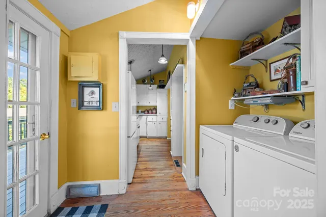 a view of balcony with furniture and wooden floor