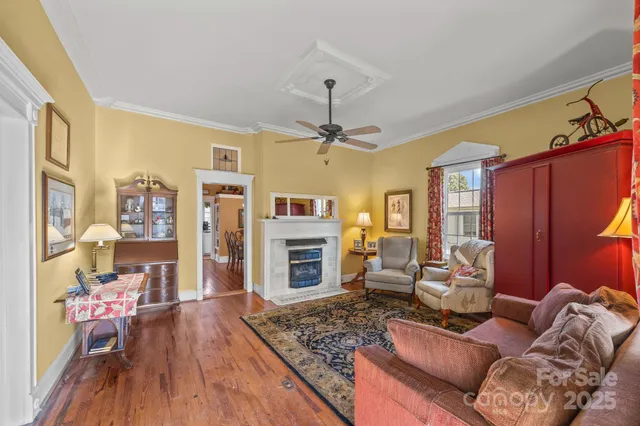 a living room with furniture fireplace and flat screen tv