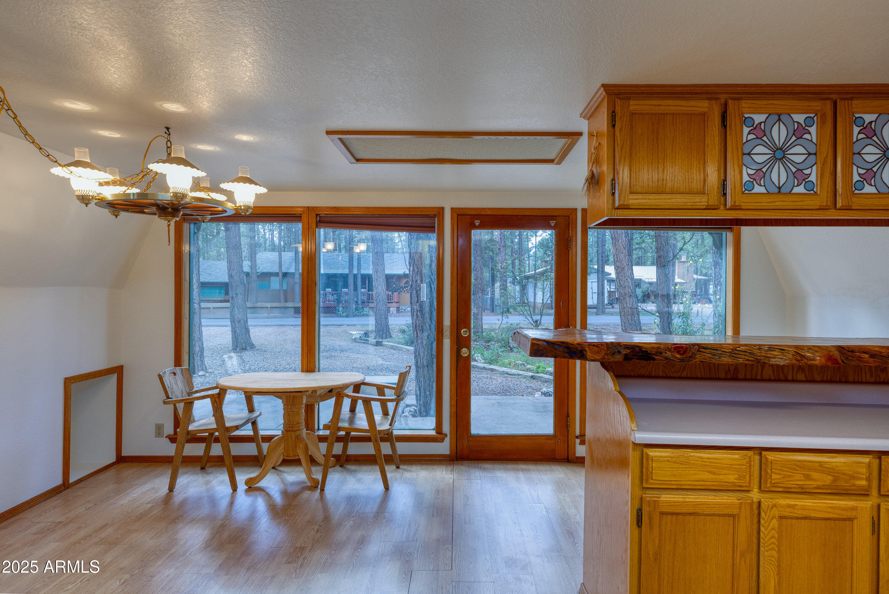 5382 Pine Dawn Road Lakeside, AZ 85929 - Photo 13 of 38 a view of a dining room with furniture and chandelier