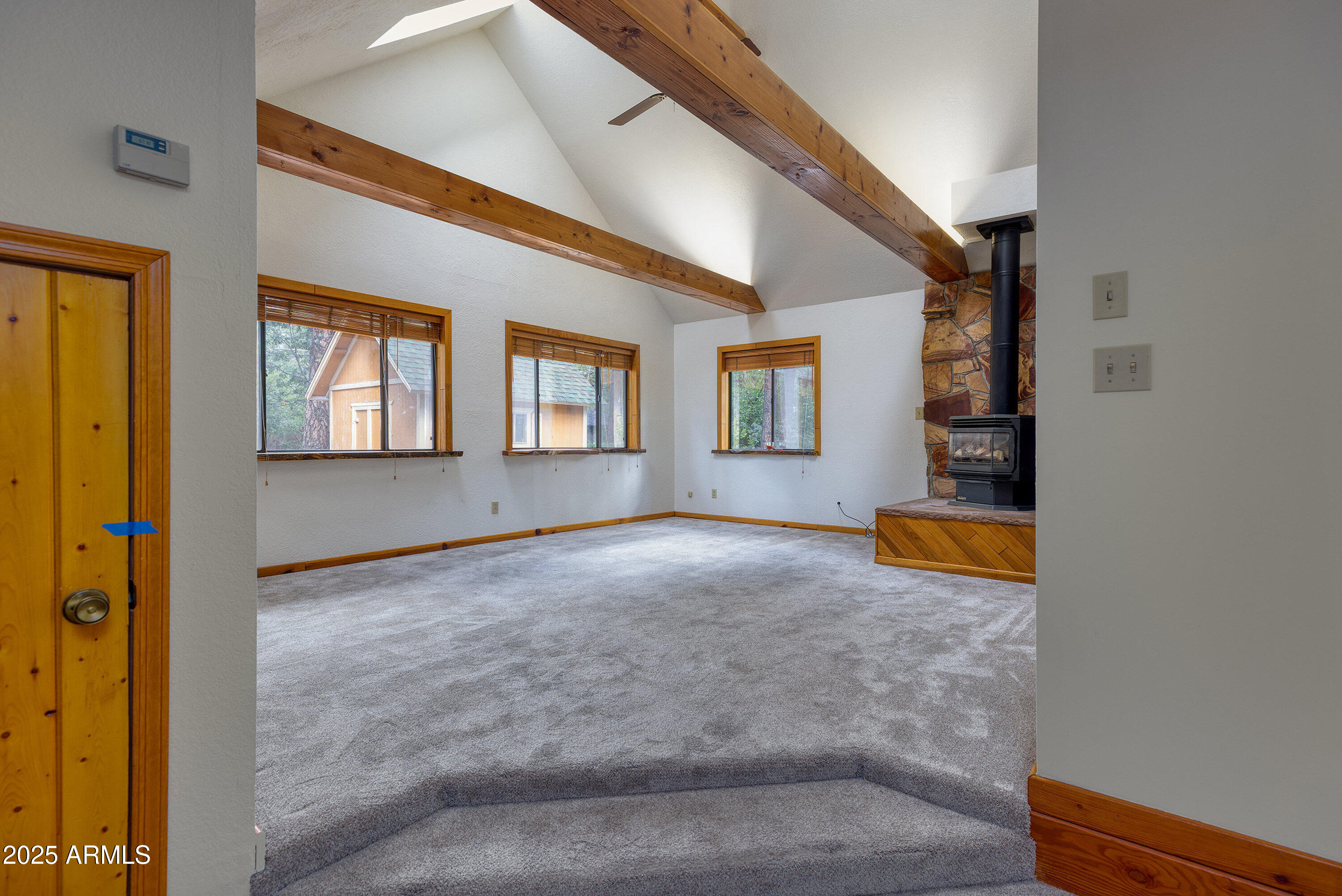 5382 Pine Dawn Road Lakeside, AZ 85929 - Photo 15 of 38 a view of an empty room with window and wooden floor