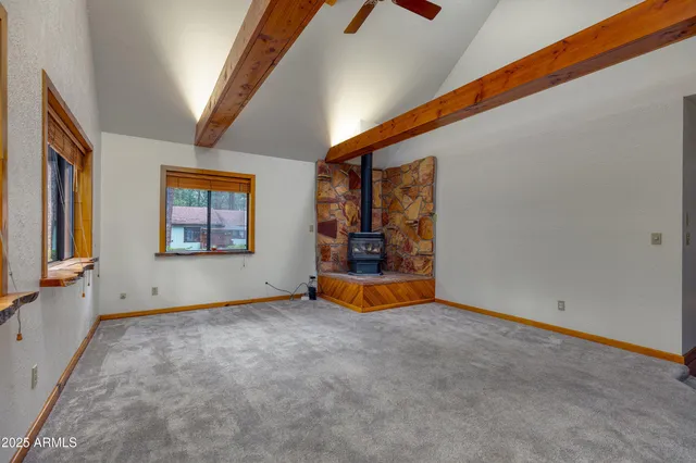 a living room with a bed and a wall painting
