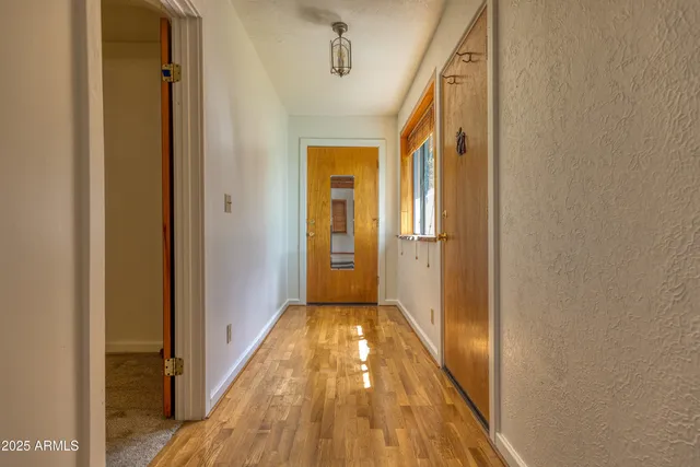 a view of a bathroom with a glass door and a vanity