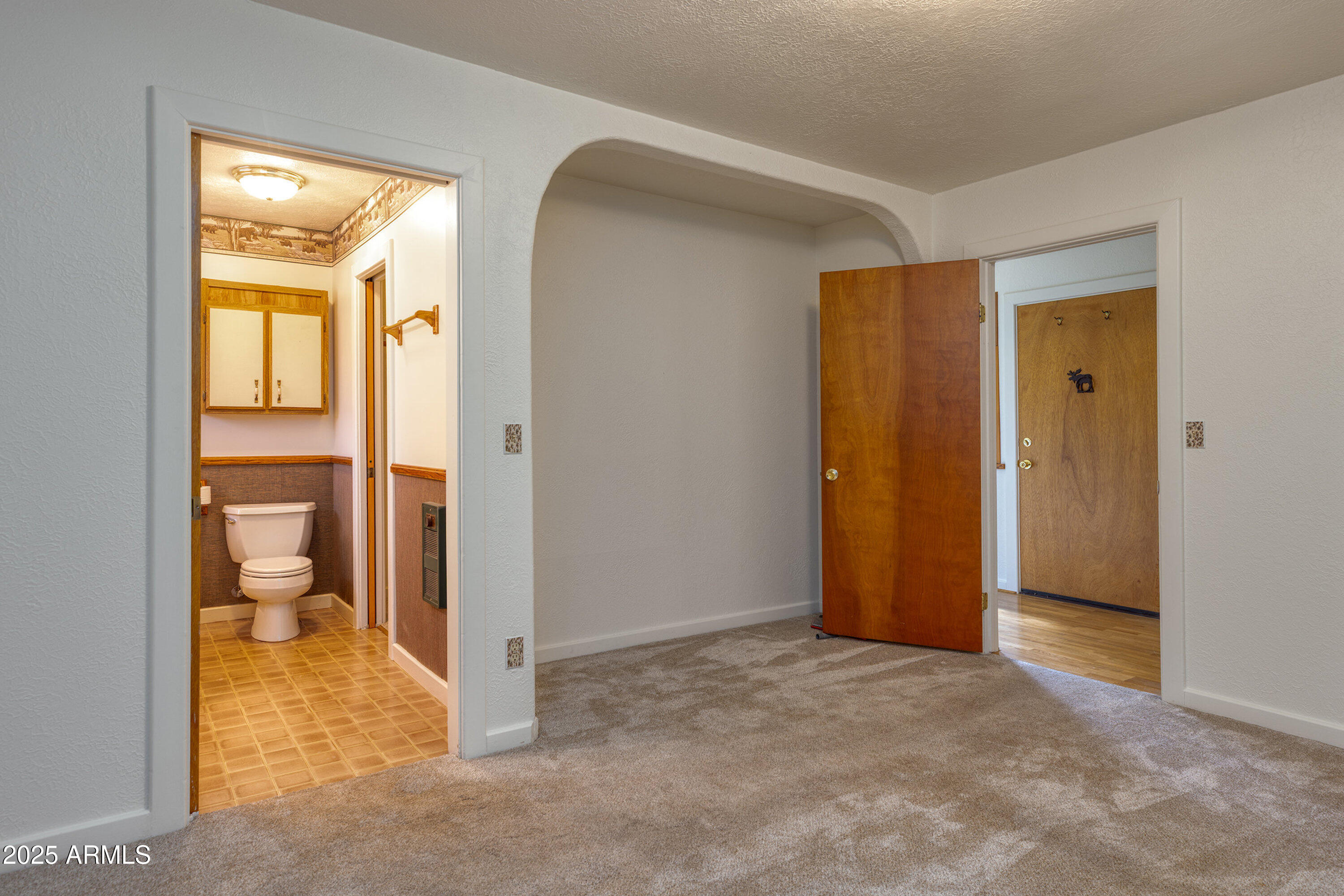 5382 Pine Dawn Road Lakeside, AZ 85929 - Photo 21 of 38 a view of a bathroom with a glass door and a vanity