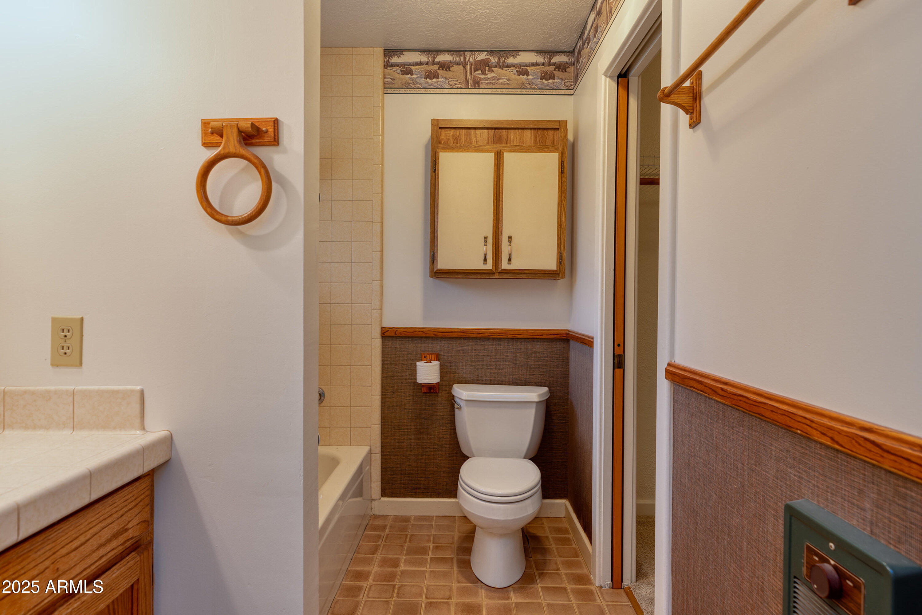 5382 Pine Dawn Road Lakeside, AZ 85929 - Photo 23 of 38 a bathroom with a toilet sink and mirror