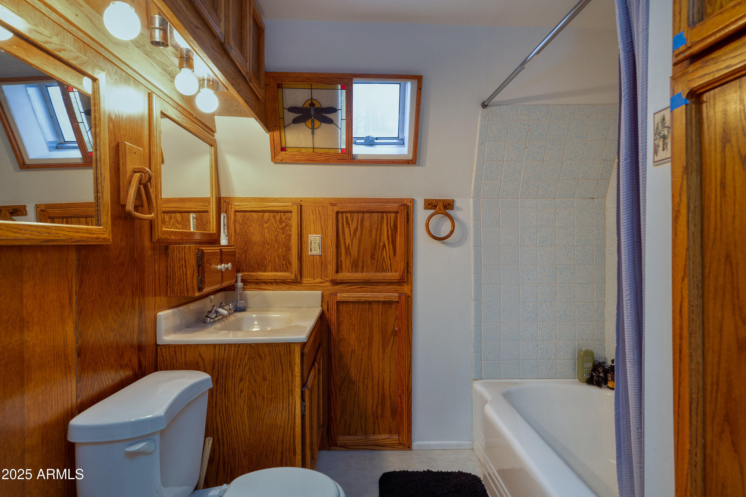 5382 Pine Dawn Road Lakeside, AZ 85929 - Photo 25 of 38 a bathroom with a sink toilet mirror vanity and bathtub