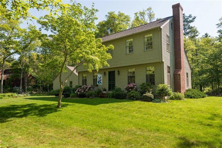 110 Olde Knoll Road Marion, MA 02738 - Photo 1 of 12 a front view of house with yard and green space
