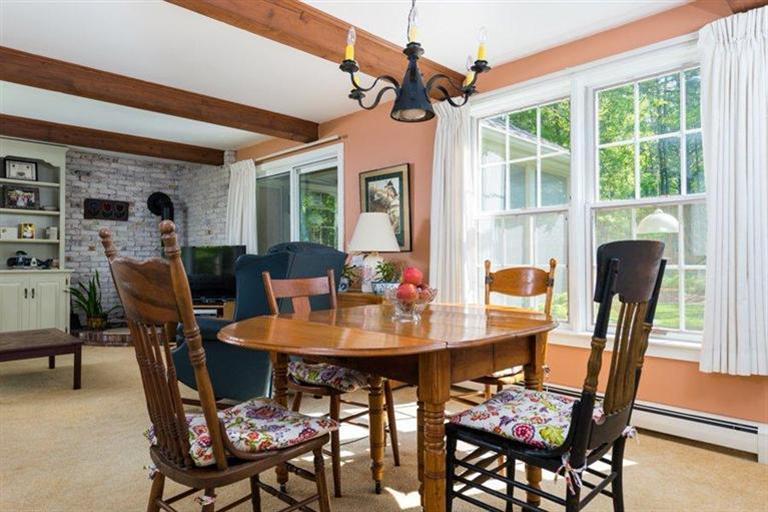 110 Olde Knoll Road Marion, MA 02738 - Photo 11 of 12 a view of a dining room with furniture window and wooden floor