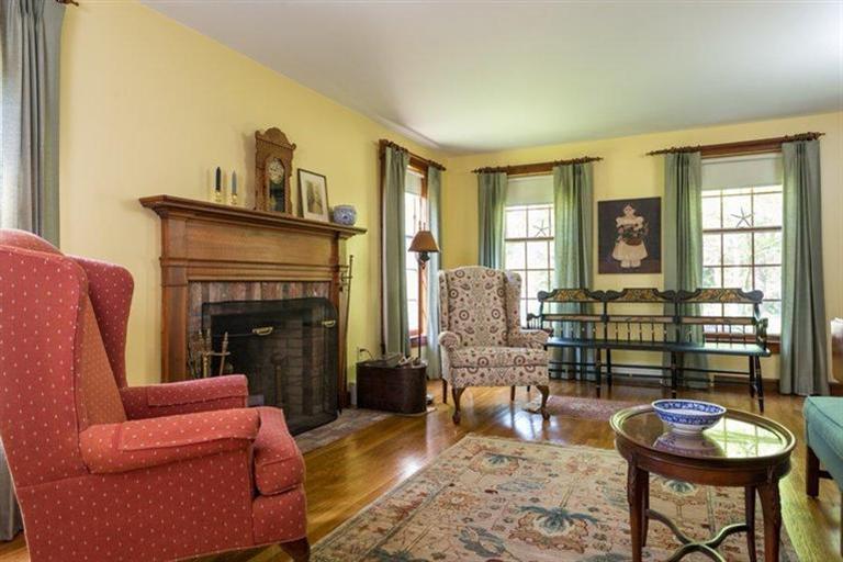 110 Olde Knoll Road Marion, MA 02738 - Photo 5 of 12 a living room with furniture and a fireplace