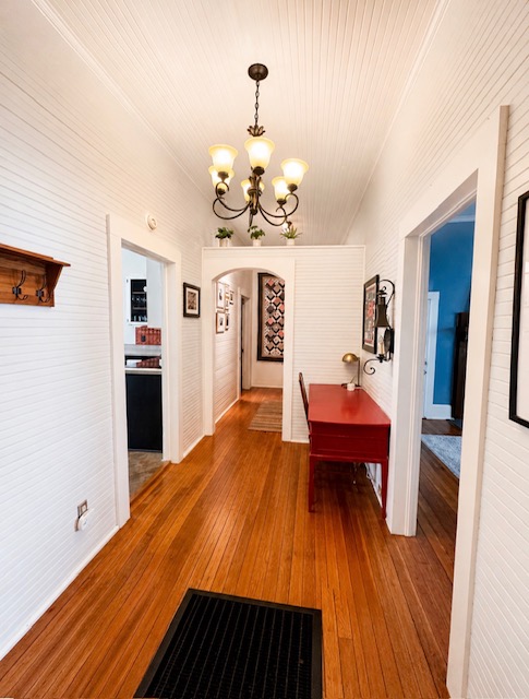 1104 Power Street Anderson, SC 29621 - Photo 26 of 34 A classic chandelier illuminates this warm hallway with gleaming wood flooring.