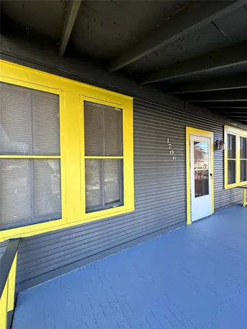 a view of a street with wooden floor