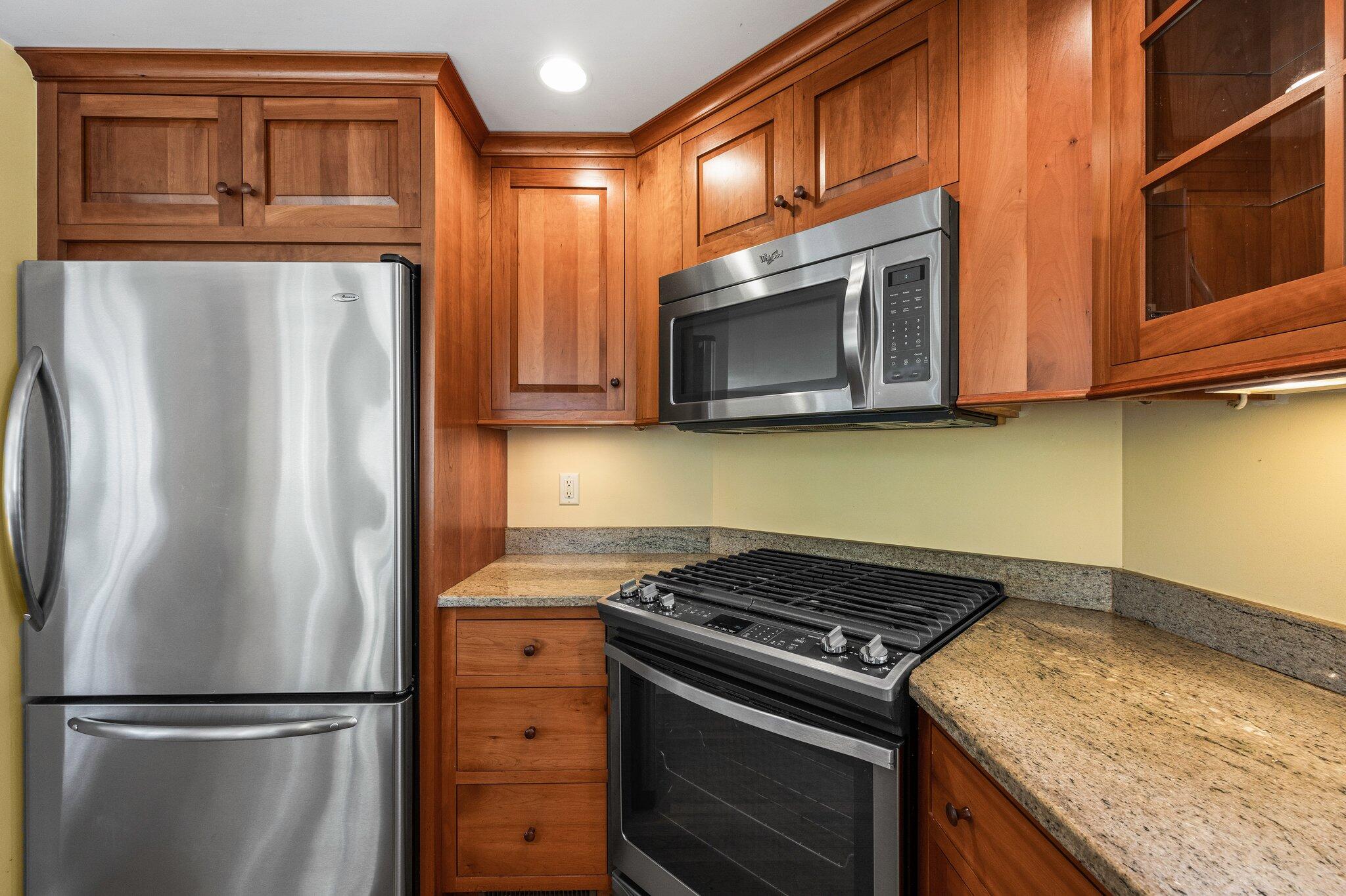 75 Whidah Road Chatham, MA 02650 - Photo 19 of 47 a kitchen with stainless steel appliances granite countertop a refrigerator stove and microwave
