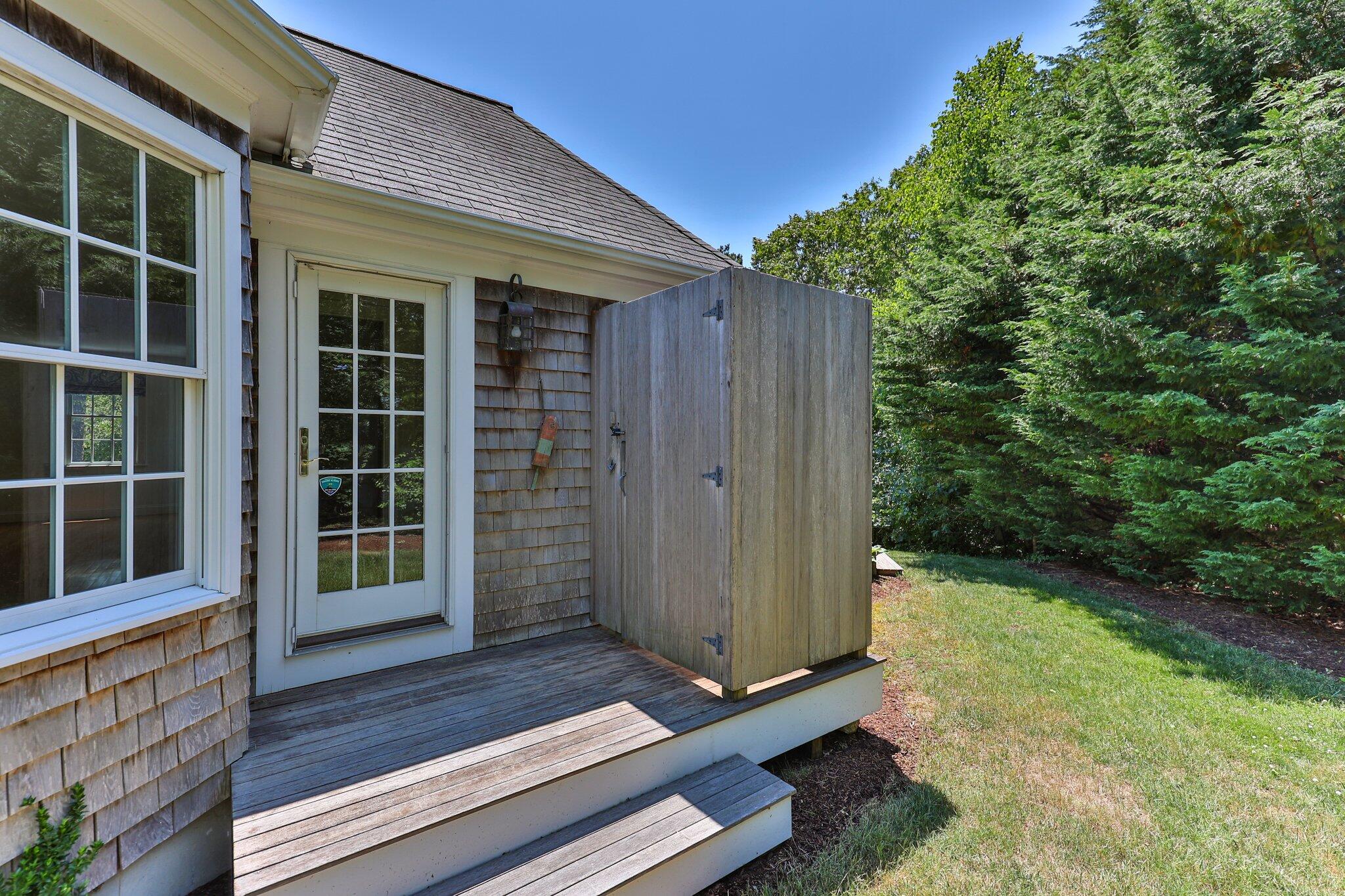 75 Whidah Road Chatham, MA 02650 - Photo 28 of 47 a view of front door of house with stairs and wooden floor