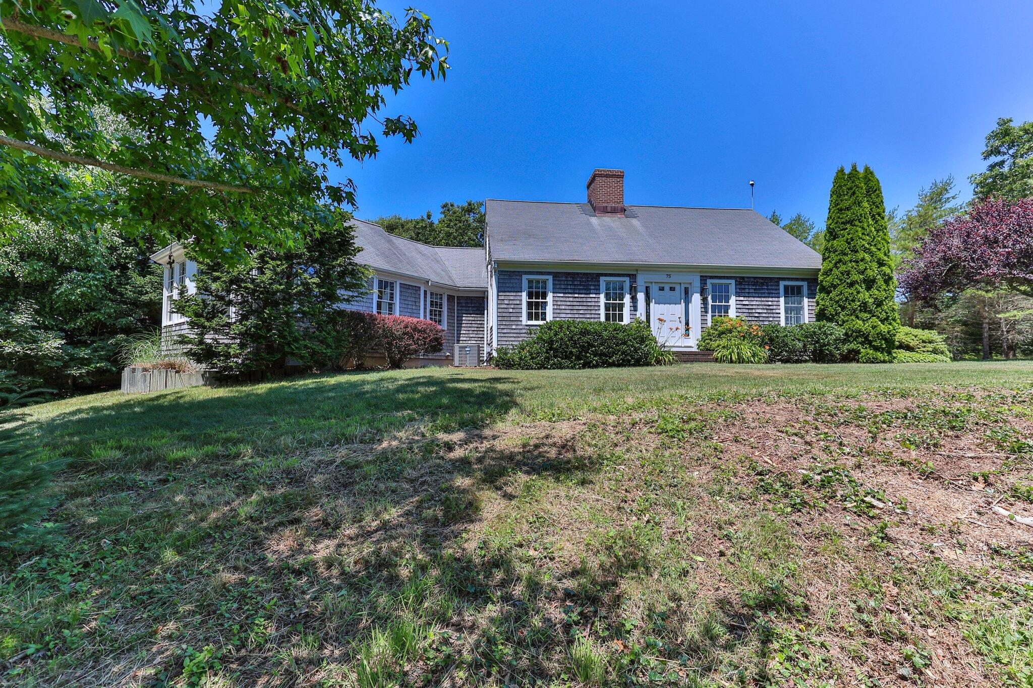 75 Whidah Road Chatham, MA 02650 - Photo 4 of 47 a front view of a house with a yard