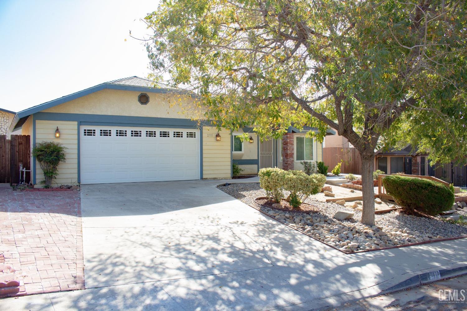 Undisclosed Address Bakersfield, CA 93306 - Photo 2 of 29 a front view of a house with a yard
