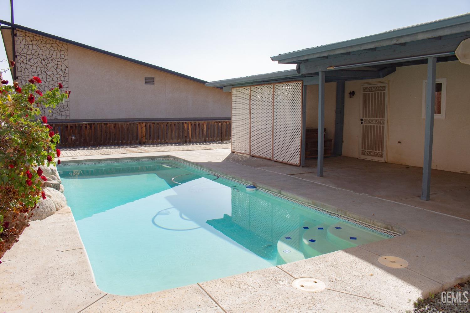 Undisclosed Address Bakersfield, CA 93306 - Photo 27 of 29 a front view of a house with a yard