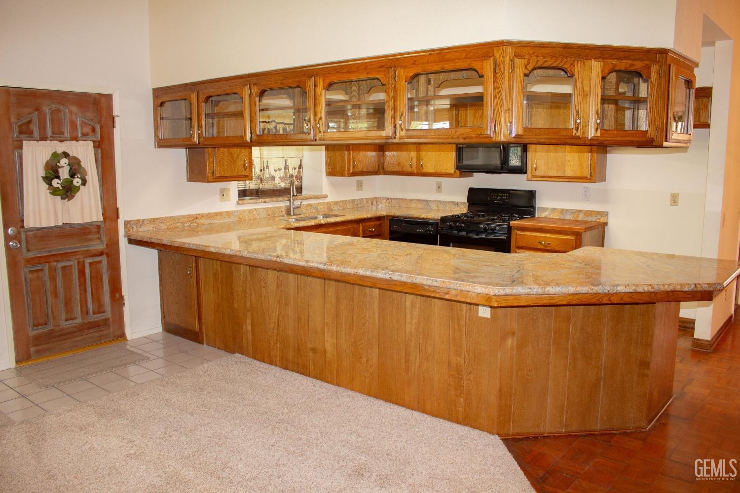 Undisclosed Address Bakersfield, CA 93306 - Photo 6 of 29 a kitchen with stainless steel appliances granite countertop a sink and cabinets