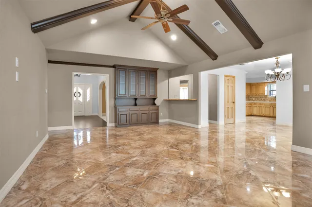 a view of a kitchen with a sink and a refrigerator