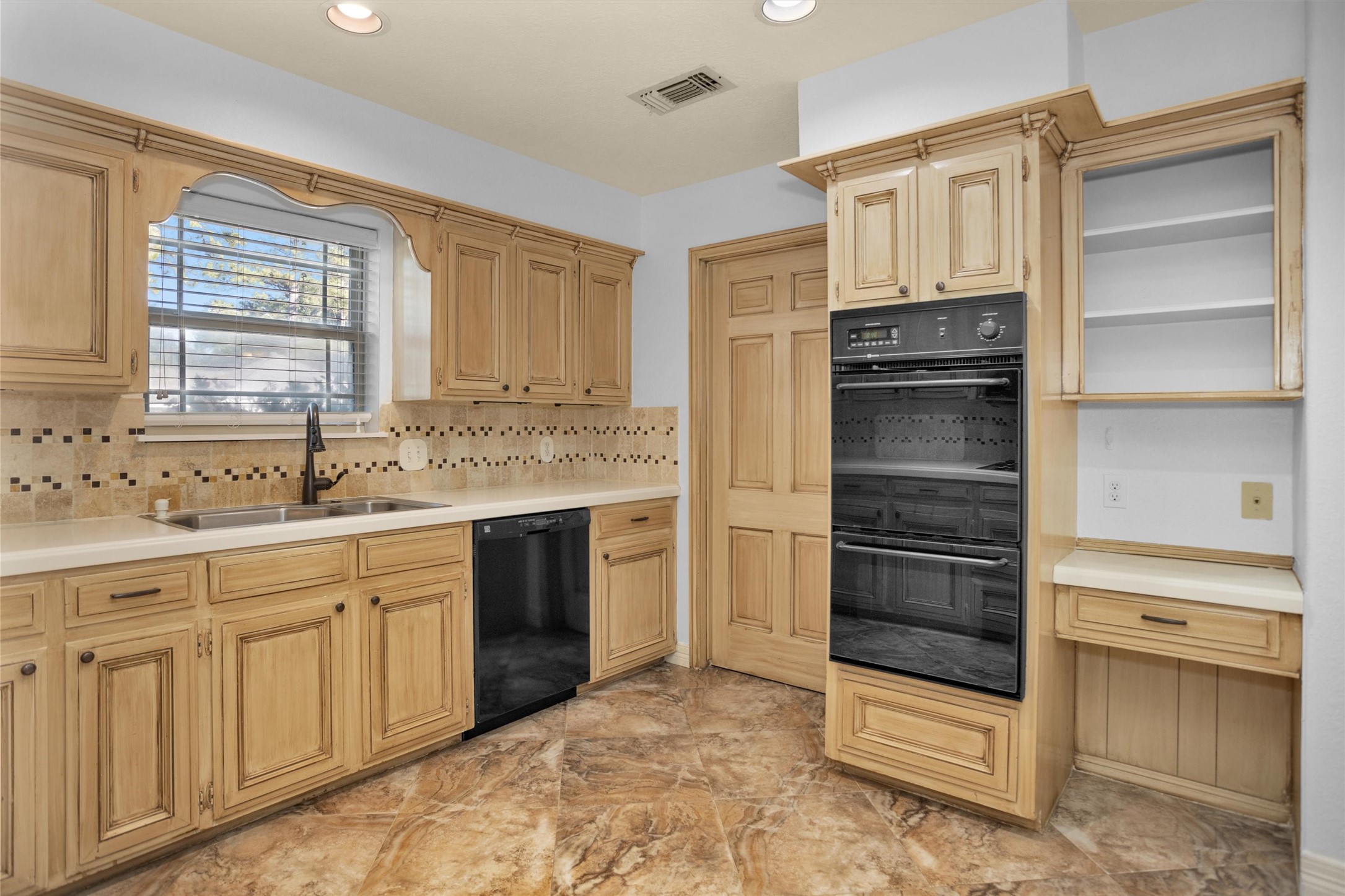 6903 Farnaby Court Spring, TX 77379 - Photo 17 of 49 a kitchen with white cabinets and white appliances