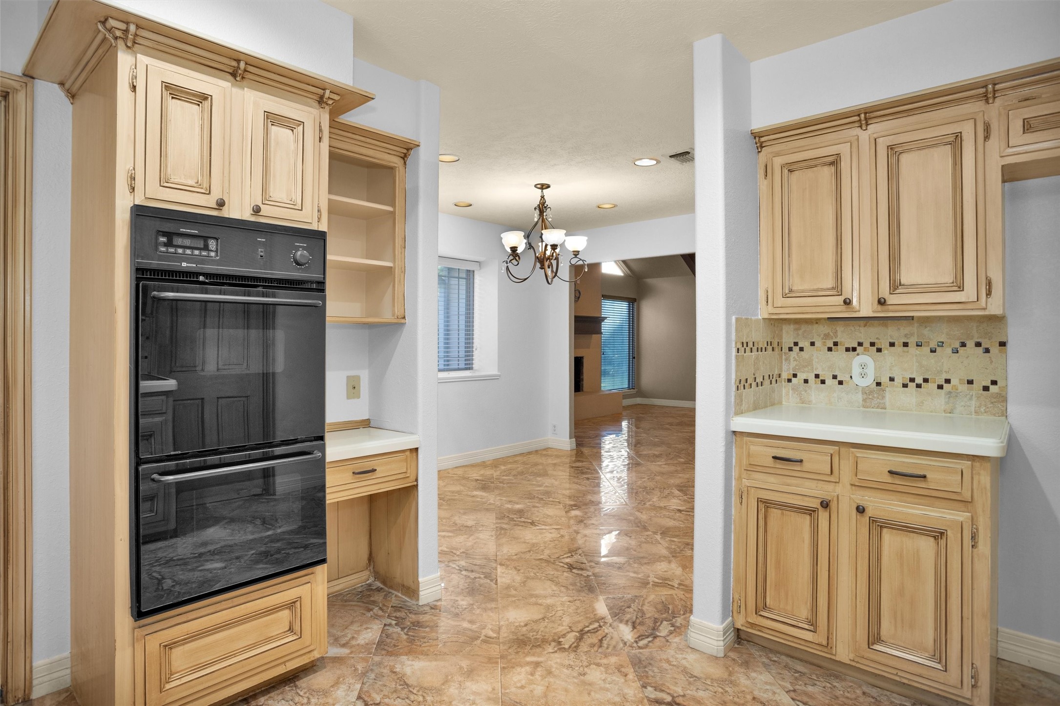 6903 Farnaby Court Spring, TX 77379 - Photo 18 of 49 a view of kitchen with granite countertop cabinets and refrigerator