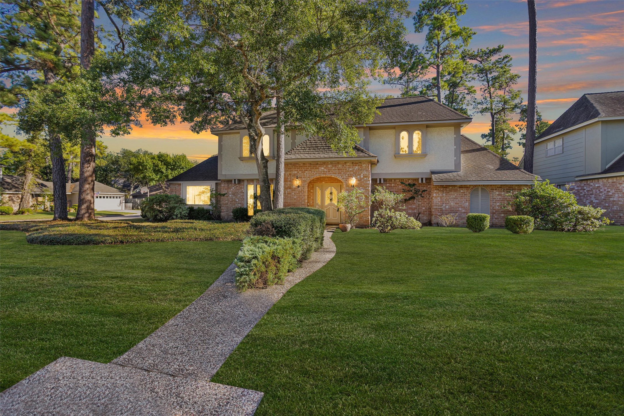 6903 Farnaby Court Spring, TX 77379 - Photo 2 of 49 a front view of a house with a garden