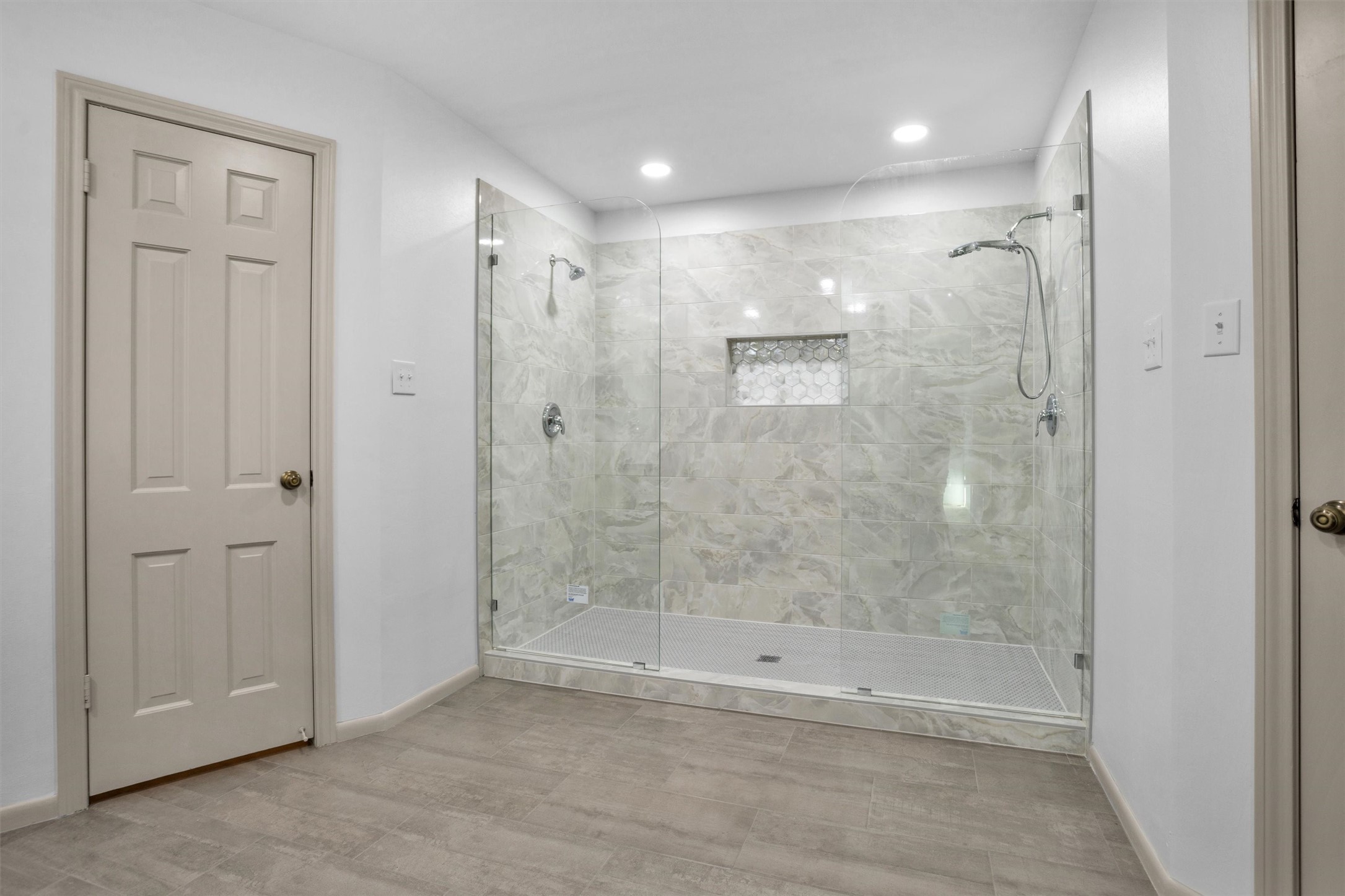 6903 Farnaby Court Spring, TX 77379 - Photo 26 of 49 a bathroom with a shower and a glass door