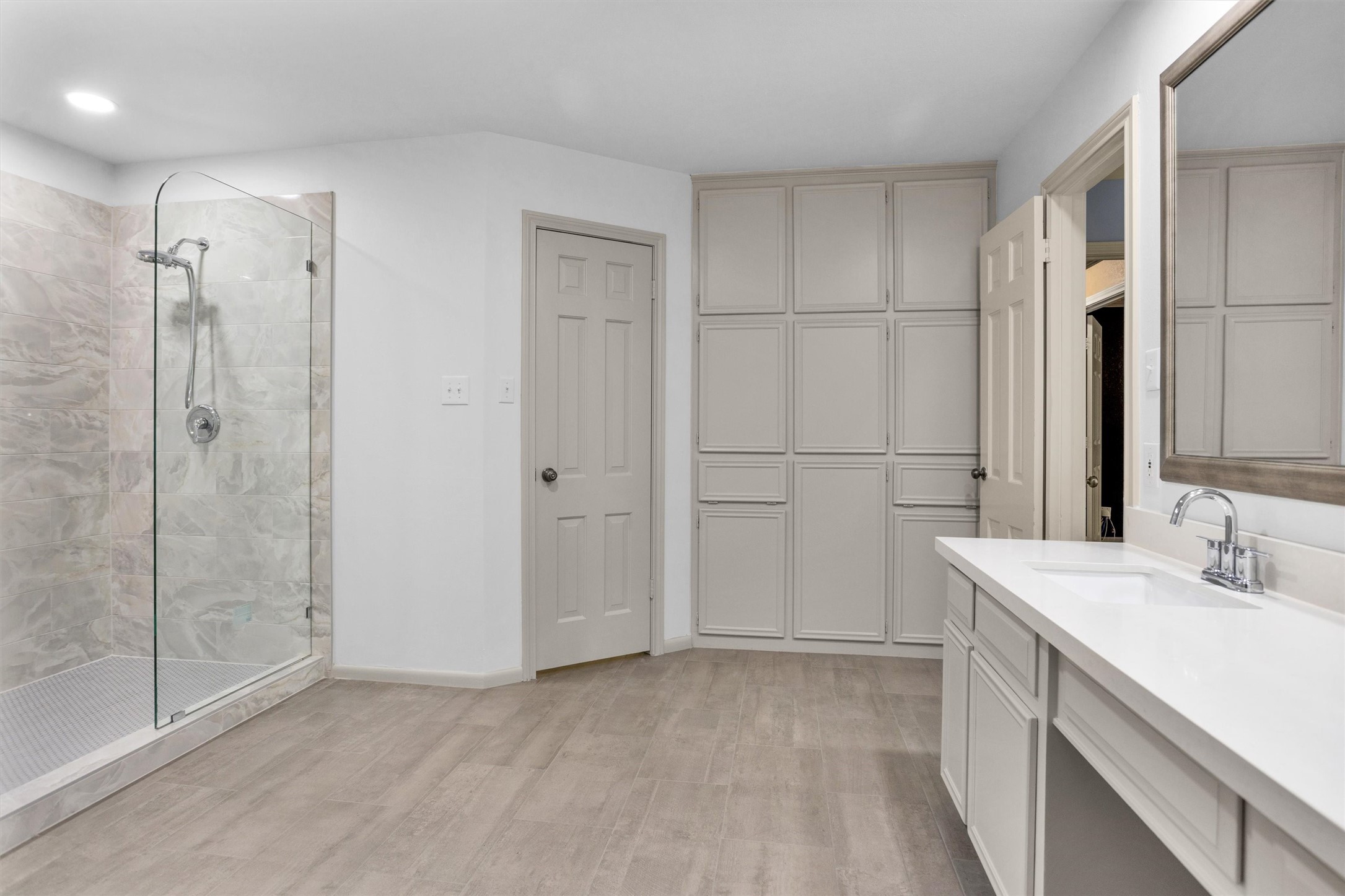 6903 Farnaby Court Spring, TX 77379 - Photo 28 of 49 a view of a bathroom with a sink and a mirror