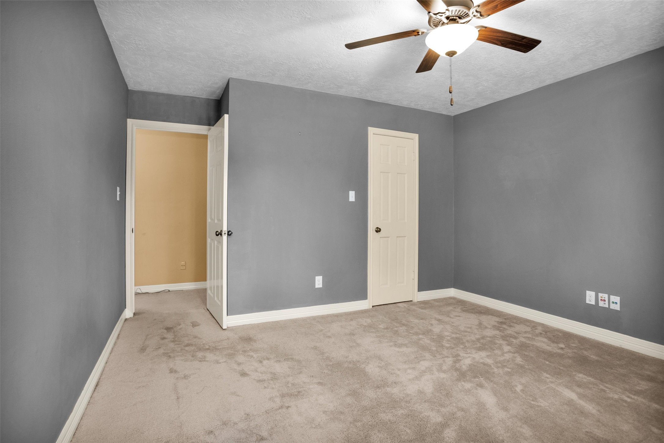 6903 Farnaby Court Spring, TX 77379 - Photo 34 of 49 an empty room with closet and a chandelier fan