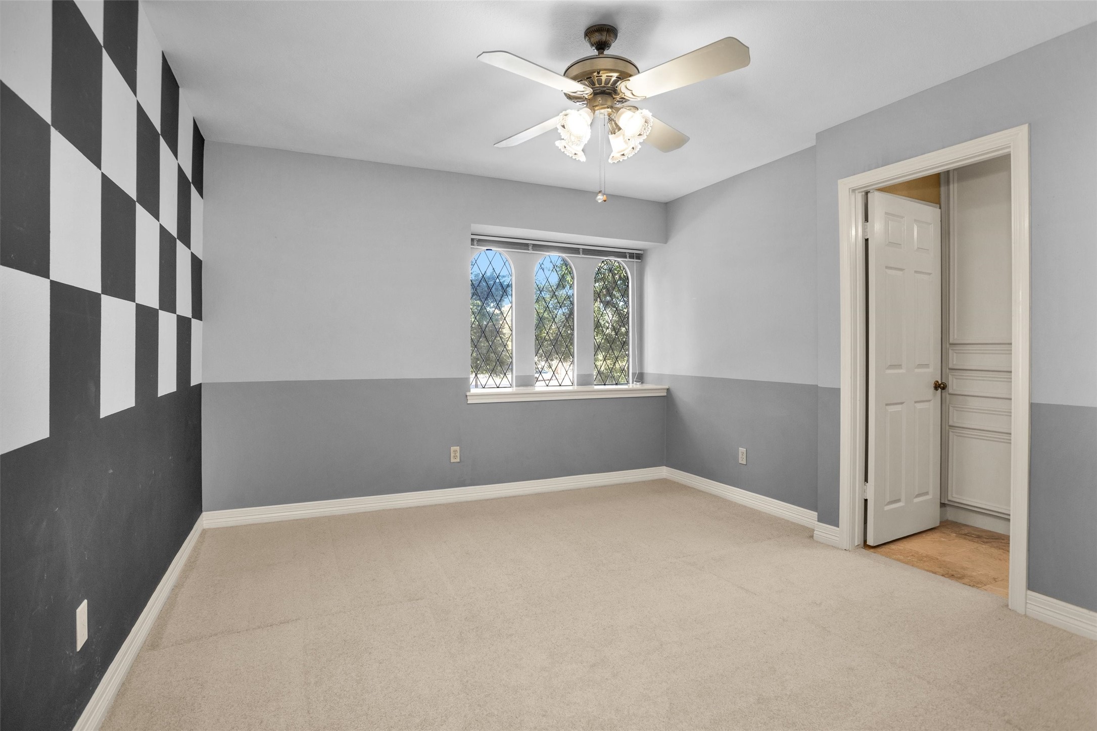 6903 Farnaby Court Spring, TX 77379 - Photo 35 of 49 an empty room with windows and fan