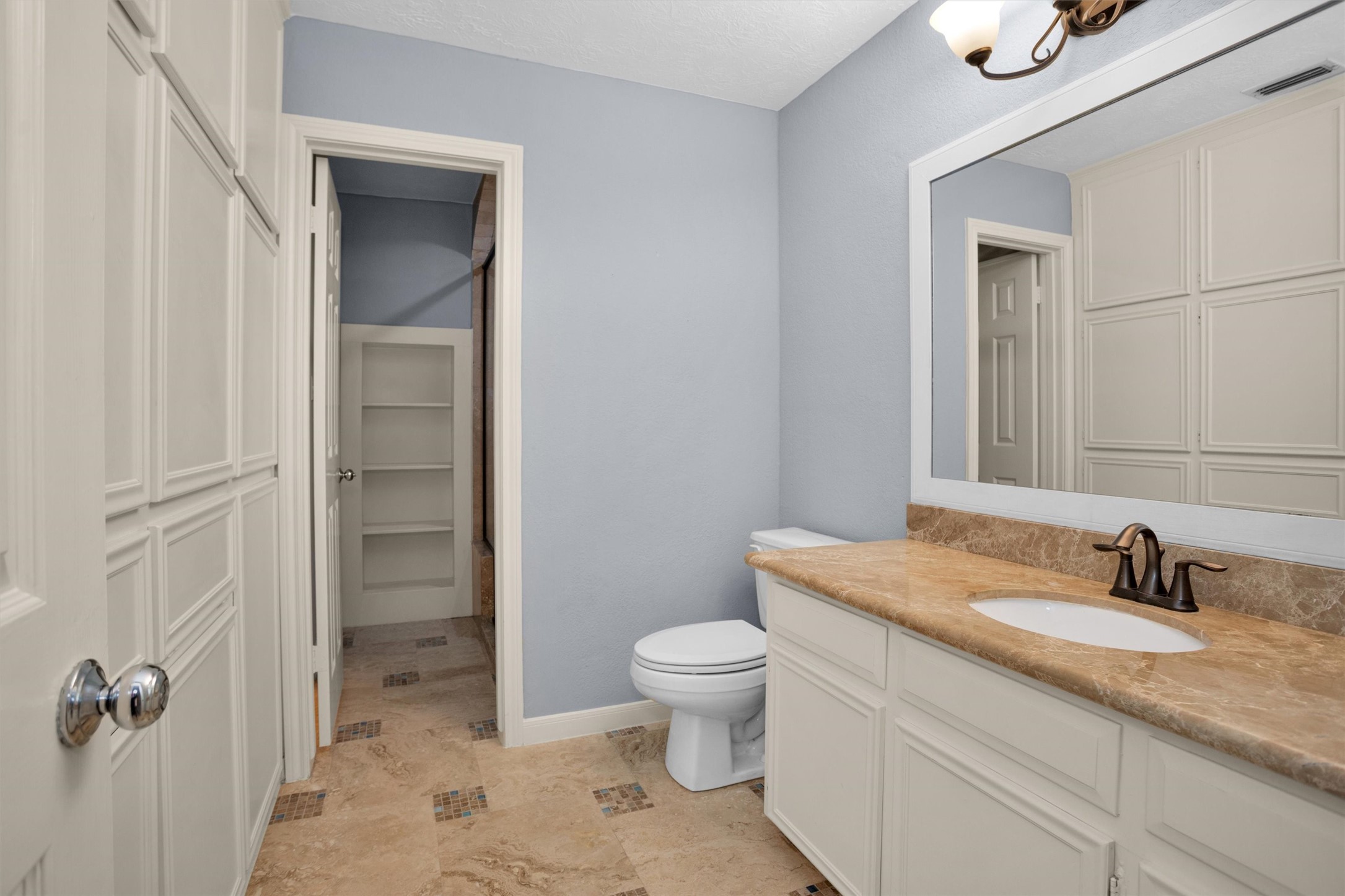 6903 Farnaby Court Spring, TX 77379 - Photo 38 of 49 a bathroom with a granite countertop sink toilet and shower