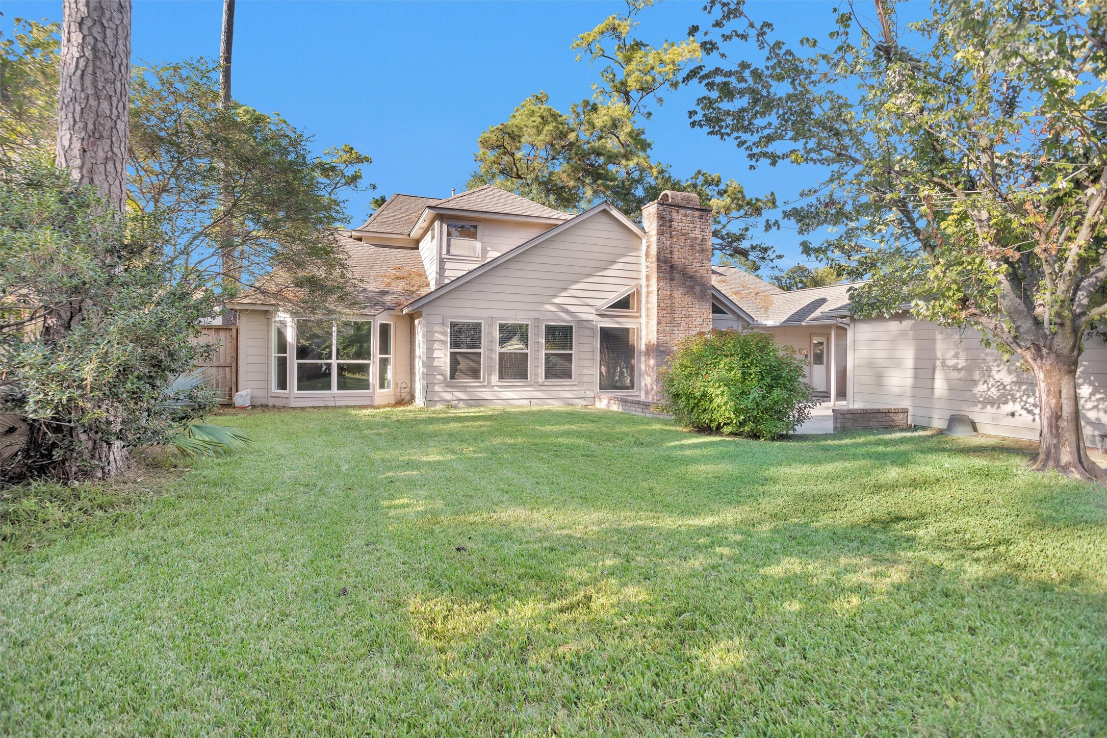 6903 Farnaby Court Spring, TX 77379 - Photo 46 of 49 a front view of a house with a garden