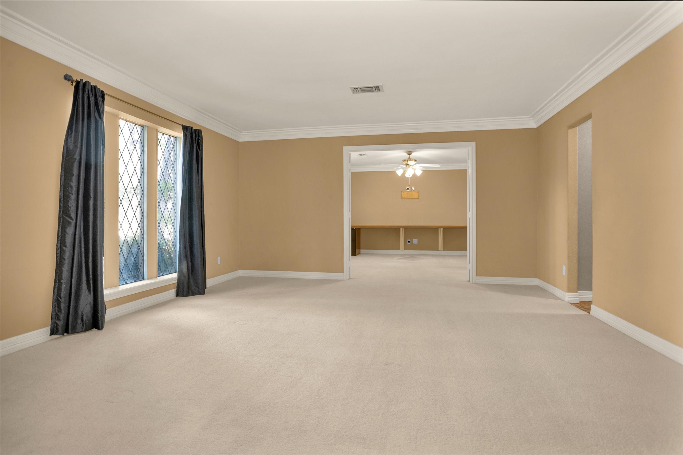 6903 Farnaby Court Spring, TX 77379 - Photo 6 of 49 a view of a livingroom with a staircase and a kitchen